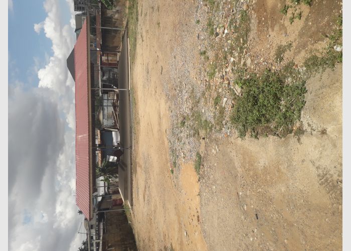 A registered plot of land with fence for sale