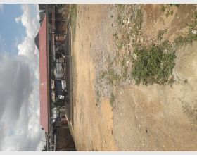 A registered plot of land with fence for sale